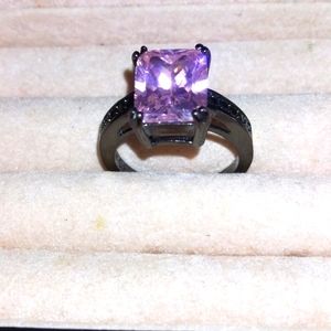 Beautiful blackened ring 5 to 5 1/4 size,big pink stone and black stones on band